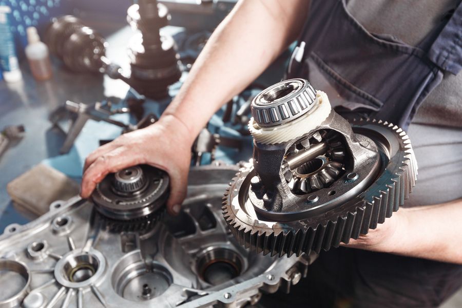 Car transmission assembly being serviced by mechanic for transmission repair in Barking, London at BNS MOTORS