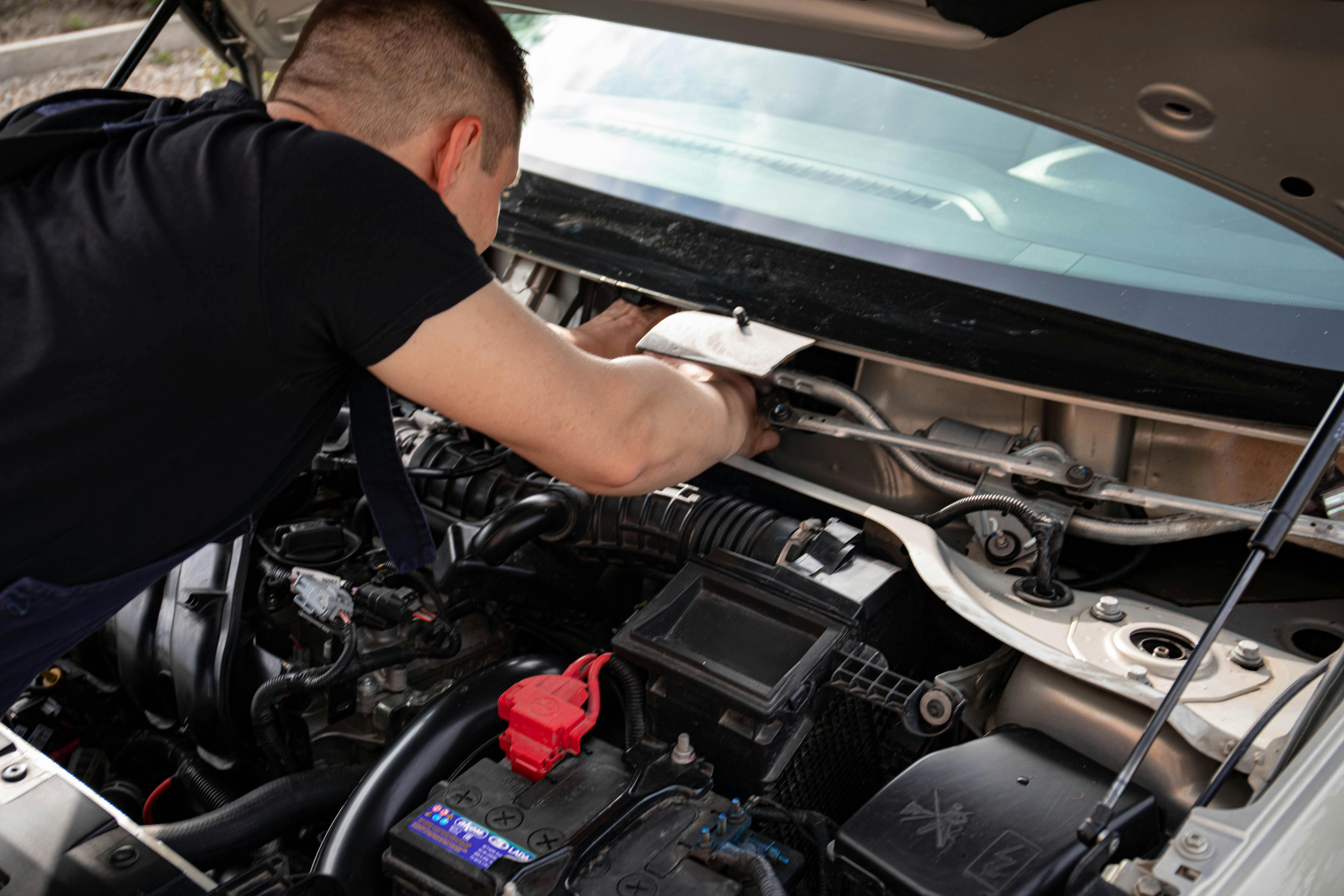Car engine being checked with diagnostic tools at BNS MOTORS, Barking, London.